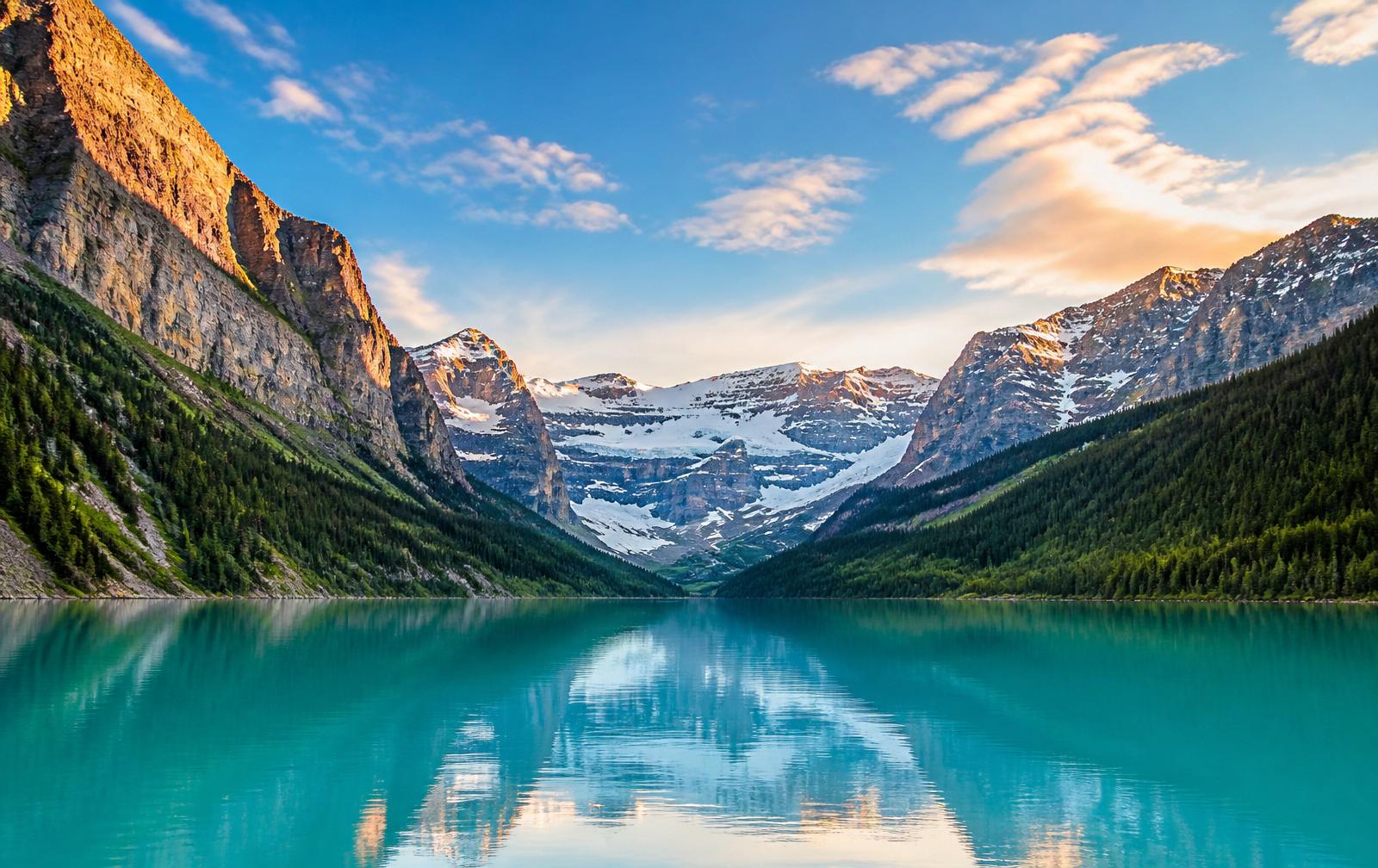 Turquoise waters of a mountain lake reflecting the Canadian Rockies in Banff National Park
